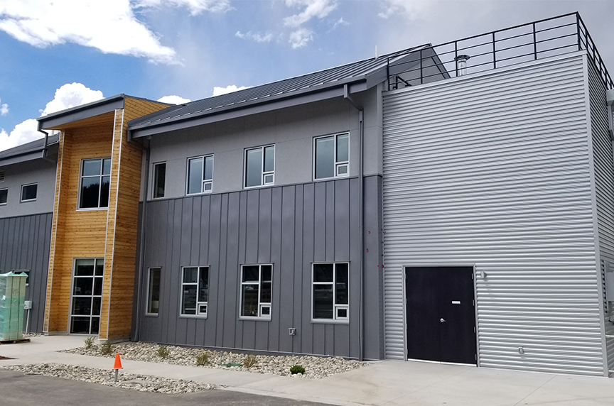 industrial building with flush wall and wave metal wall panels