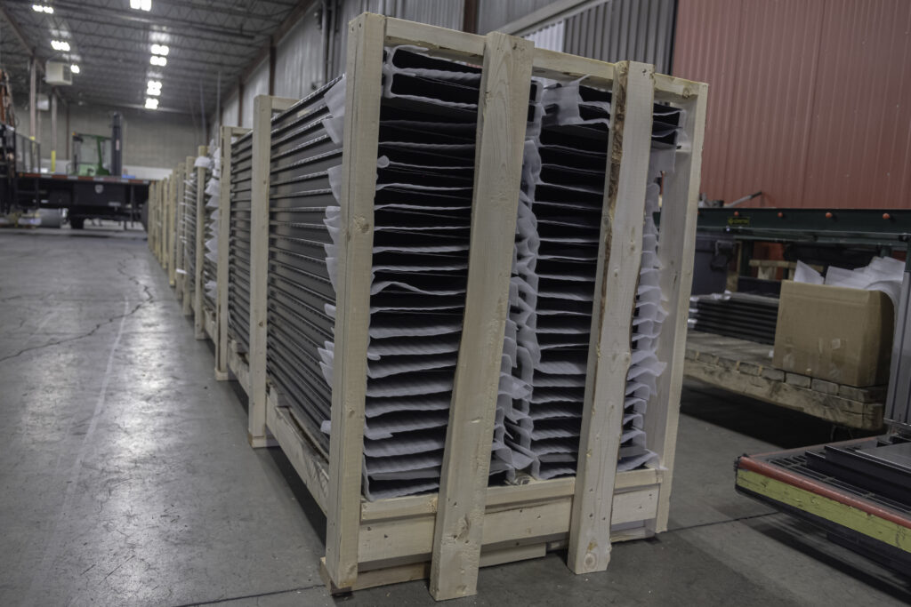 metal panels in crate for delivery to site