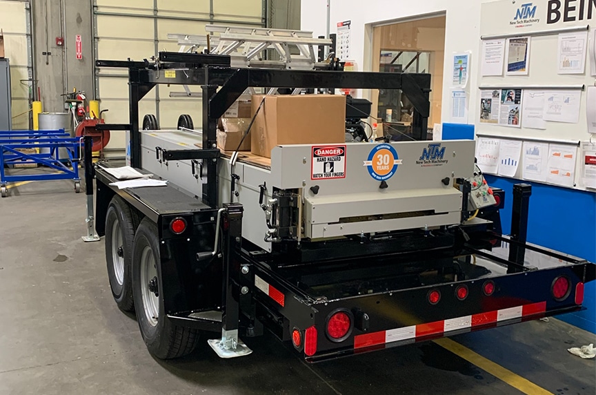 portable roof panel machine on trailer in NTM facility