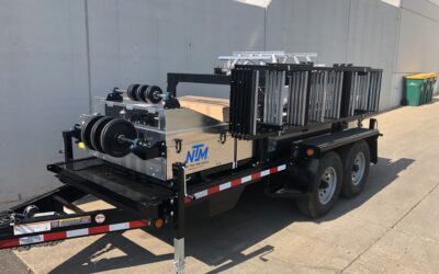 NTM SSQ II™ portable roof panel machine outside in the sunlight