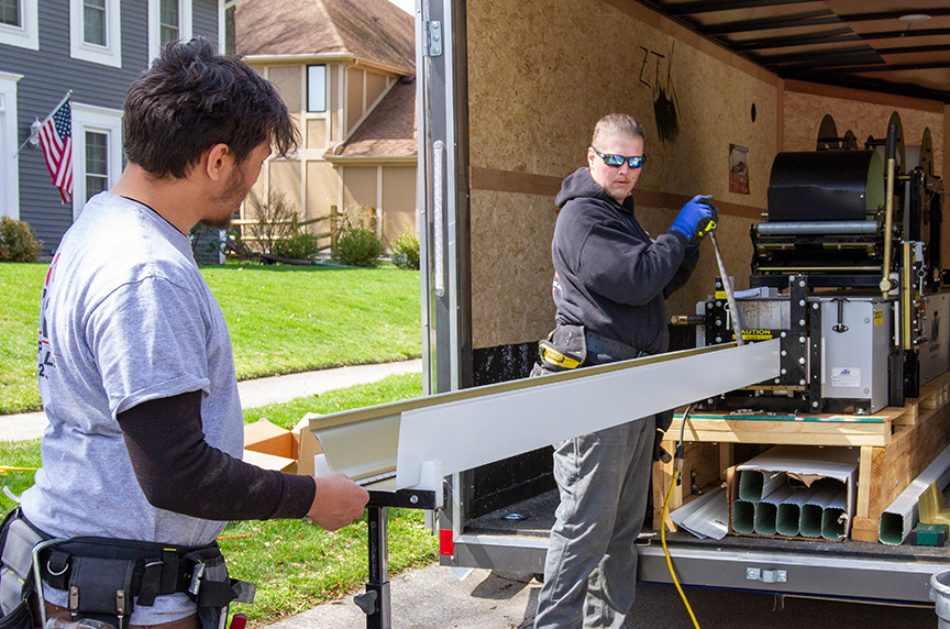 measuring gutter as it exits portable gutter rollformer