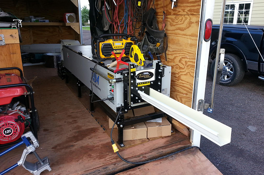 gutter machine with risers inside truck