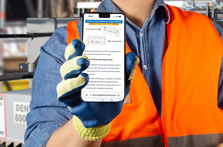 worker with smartphone and picture of machine shear and instructions on it