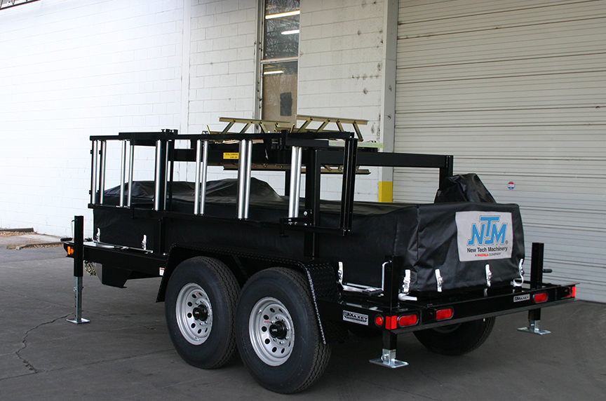 portable rollforming machine with cover on a trailer