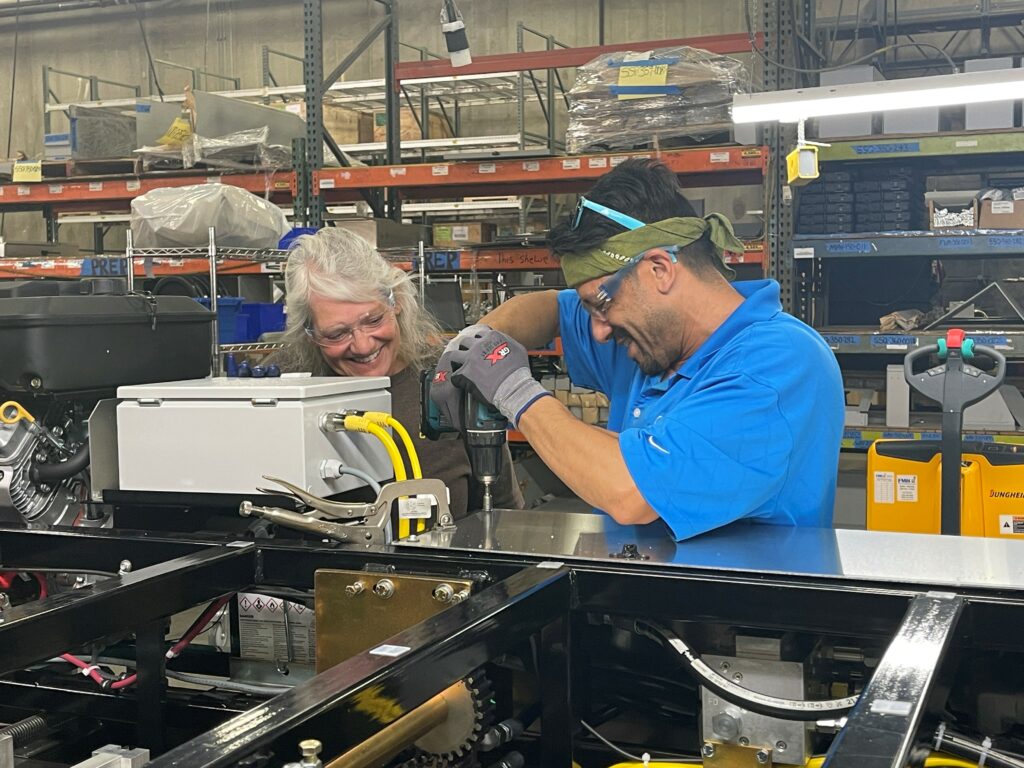 Machine specialists assembling an SSQ II MultiPro Roof Panel Machine in the NTM plant.