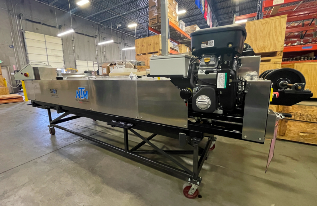 SSQ II MultiPro Roof Panel Machine with a motor in the NTM plant.