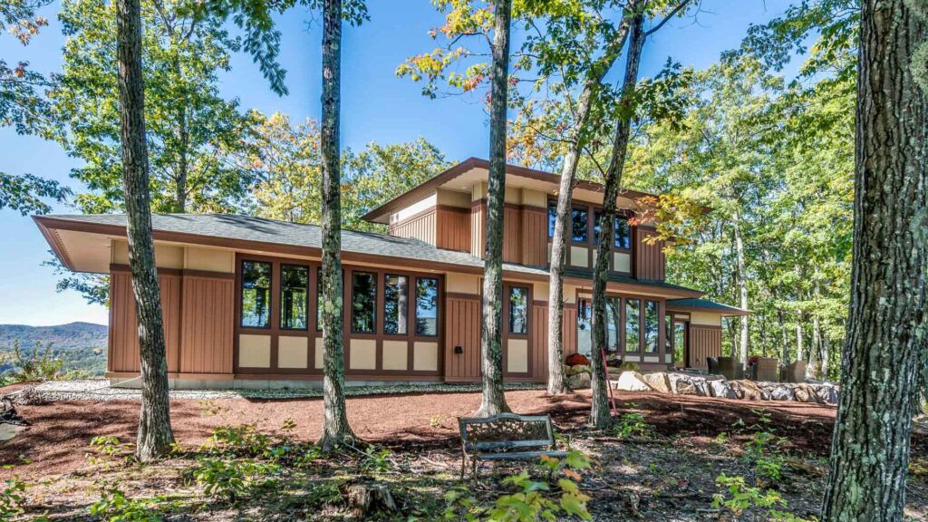 board and batten home in the woods