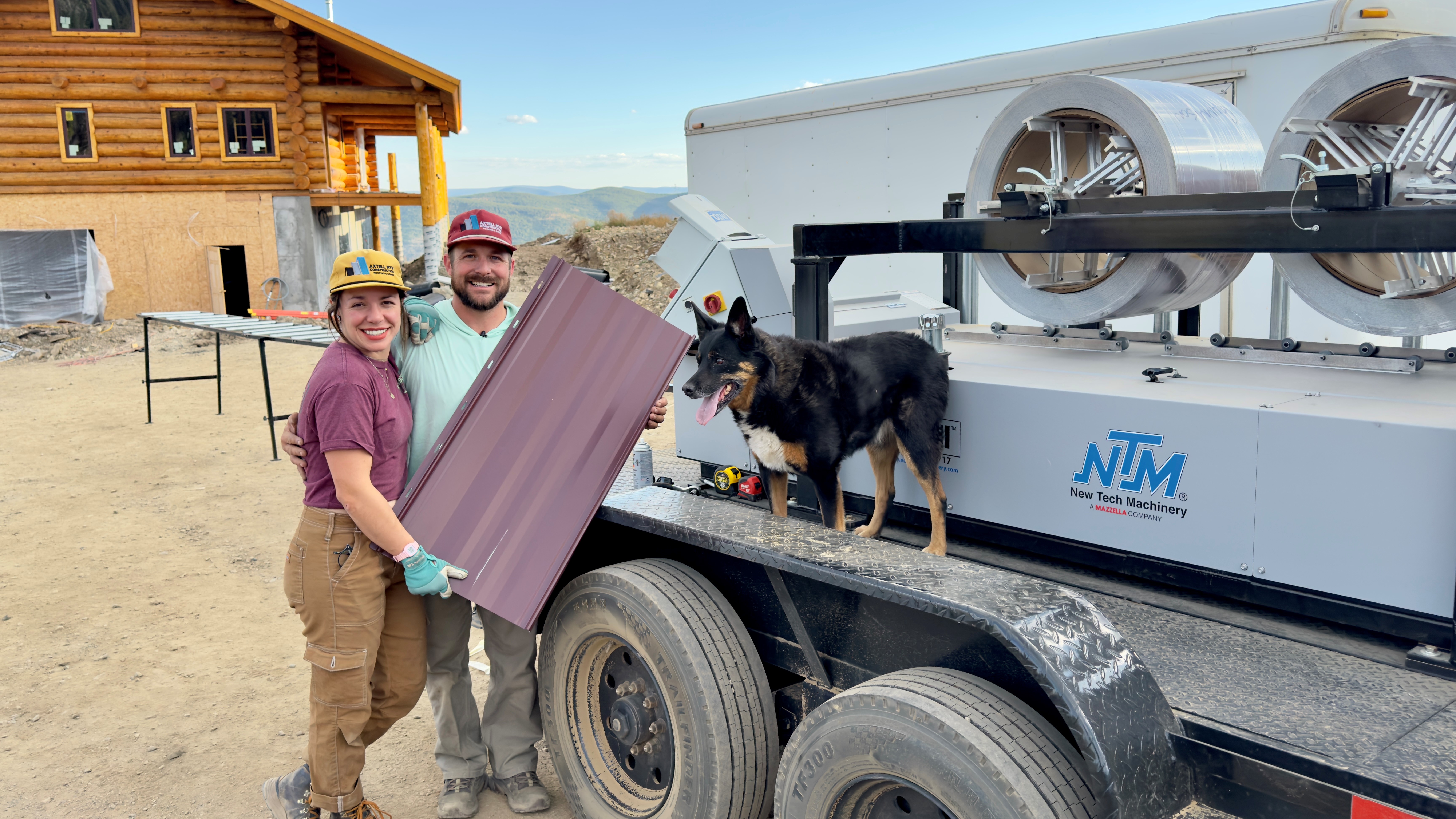 An NTM owner and his family standing with their SSQ roof panel machine