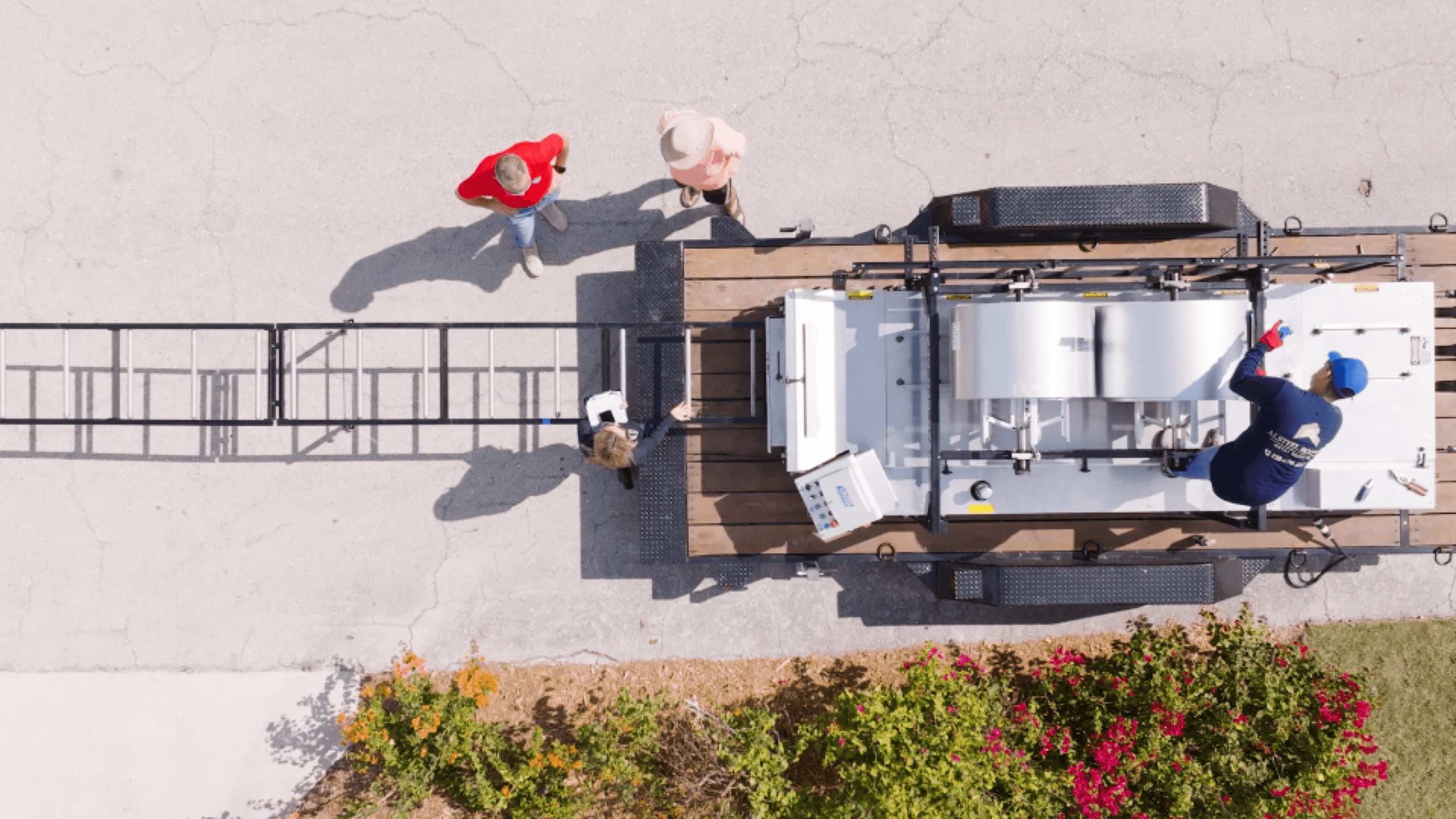 NTM operator running a portable rollformer on a rooftop job site