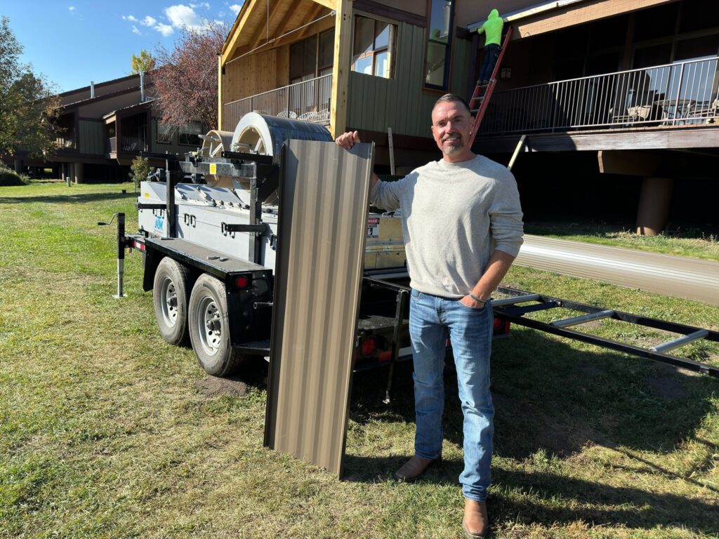 An NTM owner running a portable rollforming machine on a jobsite
