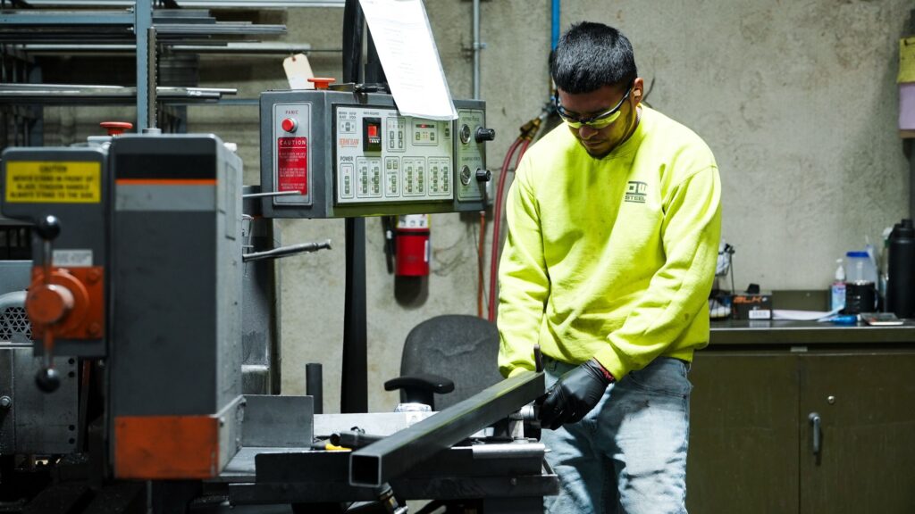 NTM production floor showing rollforming machine assembly.