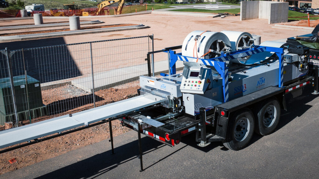 NTM machine being lifted onto a rooftop