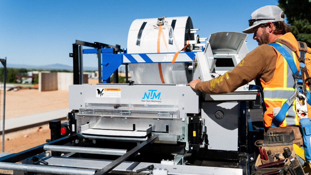 NTM operator at the SSQ3 MultiPro controls on a job site